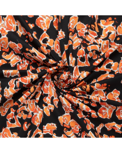 zwart satijn katoen stof met stretch met oranje abstracte bloemen