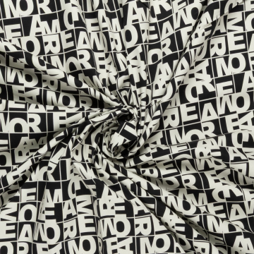 zwart satijn katoen stof met stretch met off-white letters