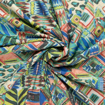 beige stretch stof met groen blauw rood batik dessin