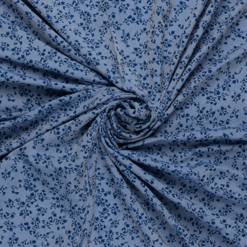 denim blauw viscose jeans optiek stof met koningsblauw bloemetjes dessin
