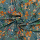 petrol viscose stof met oranje rood blauw veldbloem dessin