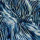Böttger Stoffenwinkel - wit viscose stretch tricot stof met blauw groenig abstract dessin - 62799