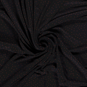 zwart stretch tricot bedrukt met brique stippen