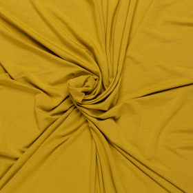 helder mosterd geel stretch tricot van bamboe