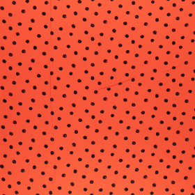 oranjerode viscose stof met zwarte stippen