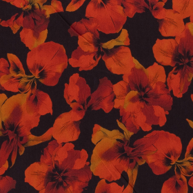 zwart stretch denim stof met oranje gele bladeren