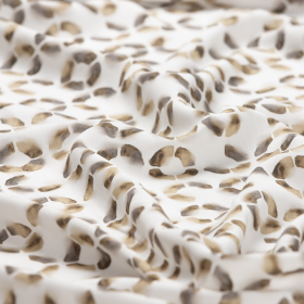 gebroken wit viscose stof met bruin-groen cirkel dessin