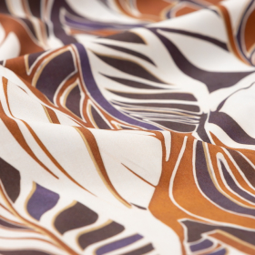creme katoenen stof met brique, indigo, zwart  bladdessin