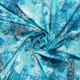 turquoise stretch satijnkatoen stof met blauw wit fantasie bladdessin