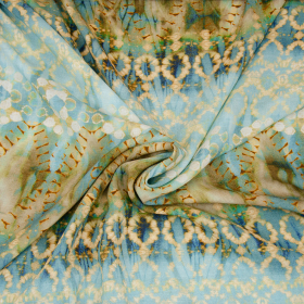 blauw viscose linnen look stof met camel batik print