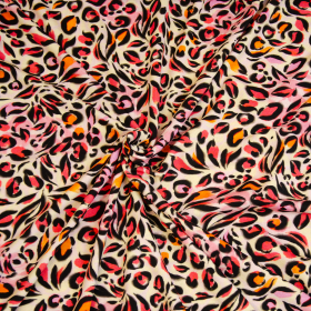 ivoor stretch tricot met fuchsia roze oranje fantasie panter dessin
